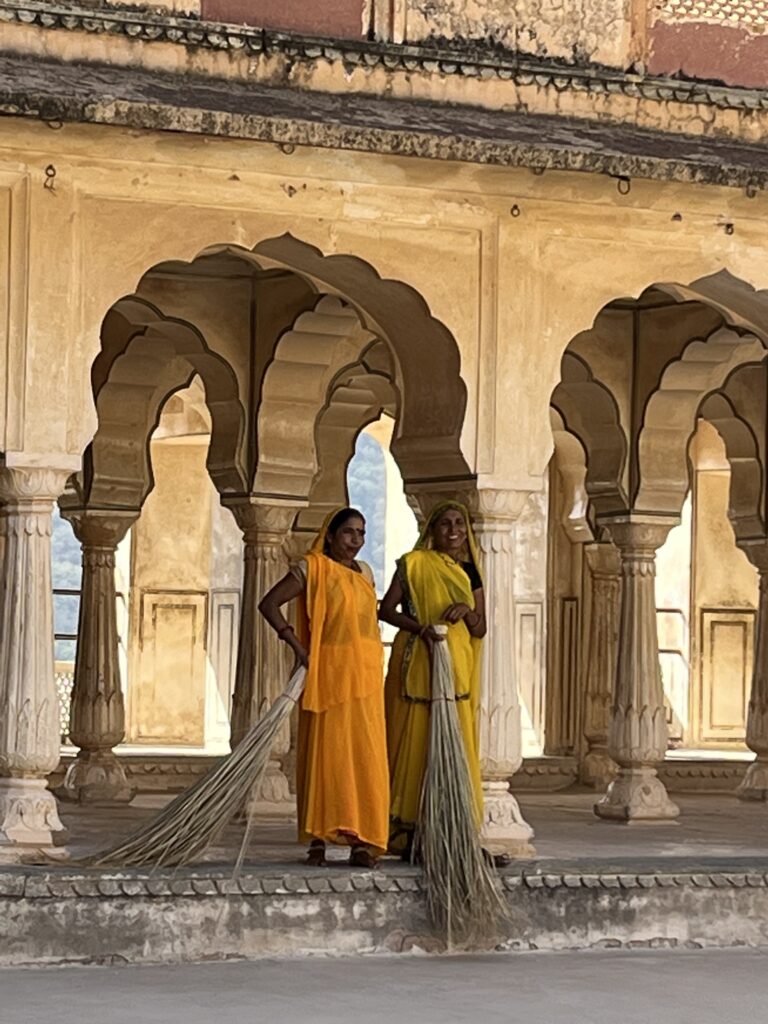 Two India local women stand under an arch My Educational India Adventure