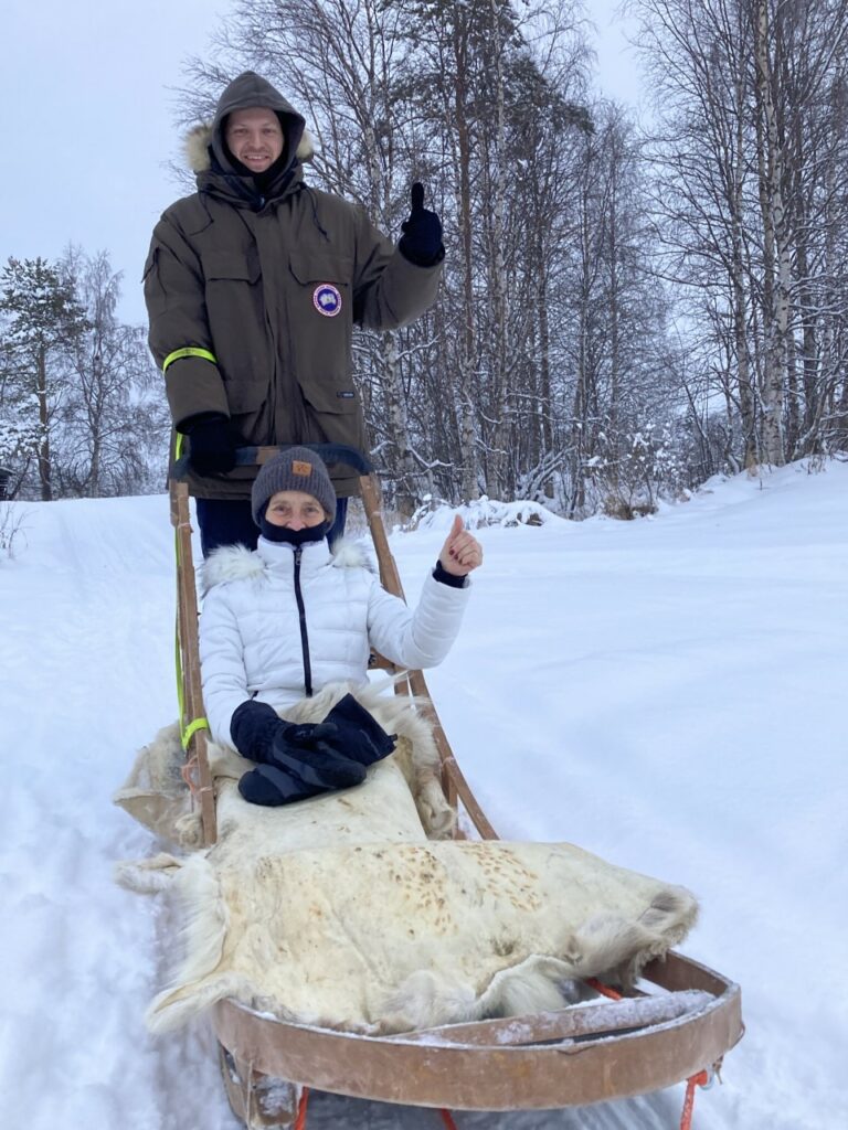 Murielle Blanchard on a dog sled in Finnish Lapland