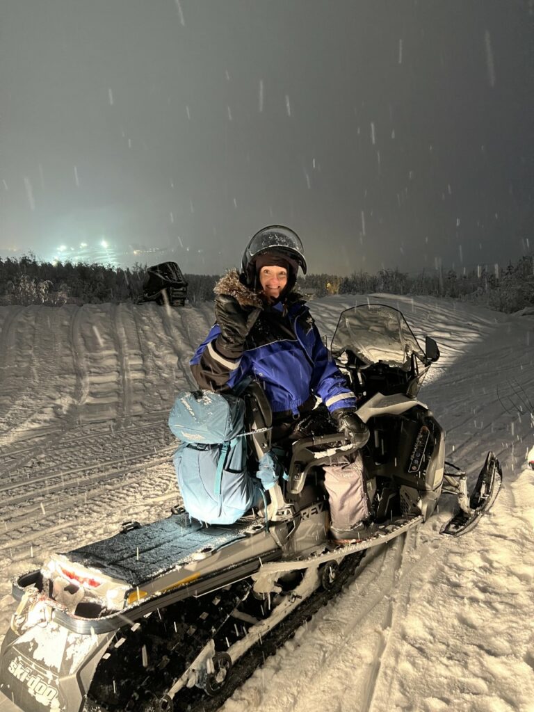 woman on a snowplow