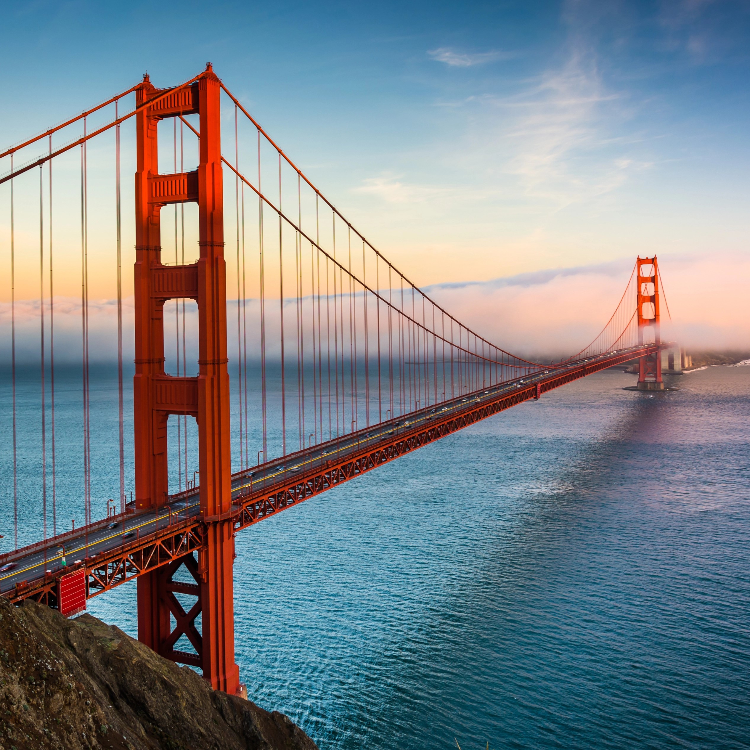 Sunset view of the Golden Gate Bridge and fog from Battery Spencer